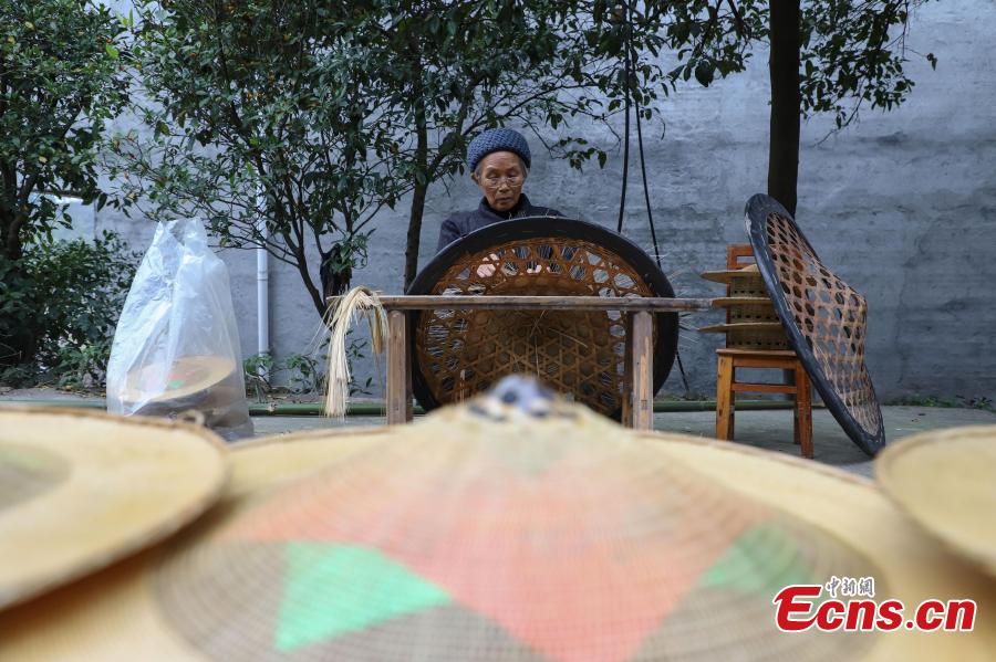 Song Erfeng knit a hat with bamboo filaments as thin as hair in a village in Tangtou town, Southwest China\'s Guizhou province.  (Photo: China News Service/ Qu Honglun)