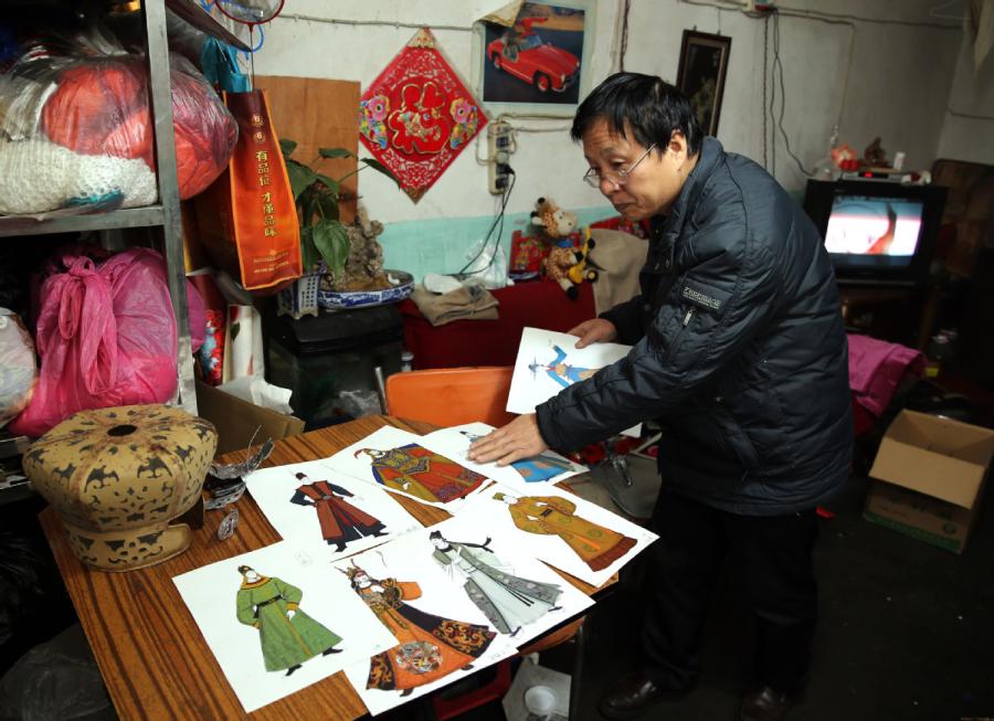 Han Xiaoli creates various headwear pieces for different stories and characters in qinqiang opera. (Photo by Huo Yan/chinadaily.com.cn)