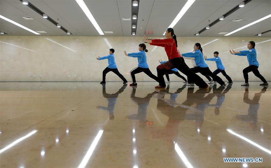 Huo Jinghong, the 5th generation descendant of Huo Yuanjia, a Chinese martial arts master, teaches martial arts at Tianjin University of Commerce in Tianjin, north China, Nov. 28, 2018. As the descendant of Huo Yuanjia, one of China\'s most revered martial arts masters, Huo Jinghong, 41, started practicing martial arts at the age of 5. After her graduation from the Wushu School of Beijing Sport University in major of Wushu Routine, Huo started her career as a gym teacher of Tianjin University of Commerce in the year of 2000. As a gym teacher, Huo teaches martial arts for the university team and offers classes on health Qigong, a new form selected from different versions of traditional Qigong for modern fitness, in the university. Later in 2015, Huo became the inheritor of Huo-style boxing, which was listed as an intangible cultural heritage in Tianjin, and since then, she has devoted herself to the inheritance and development of the martial arts handed down from the older generation of Huo\'s family. She hoped that the Huo-style boxing would help people understand more about the Chinese martial arts. Huo Yuanjia was born in Tianjin in 1868. He founded the Chin Woo Athletic Association in 1910 in Shanghai and advocated the spirit of \