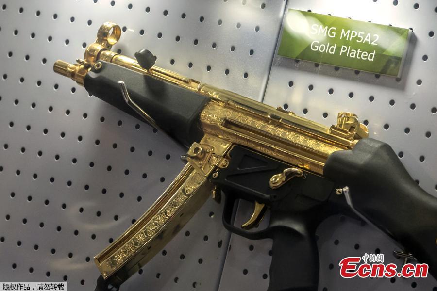 A gold plated weapon is displayed at the Pakistani stand during Egypt\'s first Service Defence Exhibition in Cairo on December 3, 2018, at the International Exhibition Center. (Photo/Agencies)