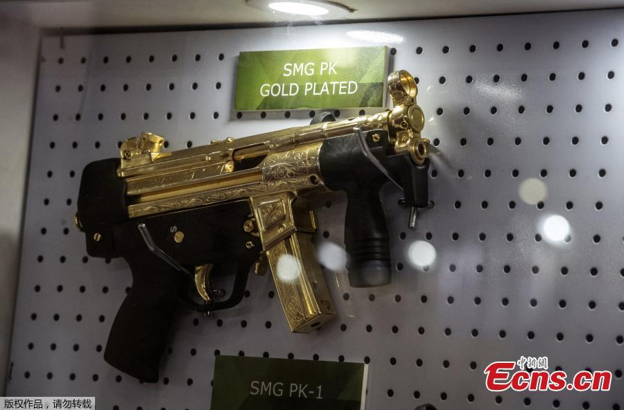 A gold plated weapon is displayed at the Pakistani stand during Egypt\'s first Service Defence Exhibition in Cairo on December 3, 2018, at the International Exhibition Center. (Photo/Agencies)