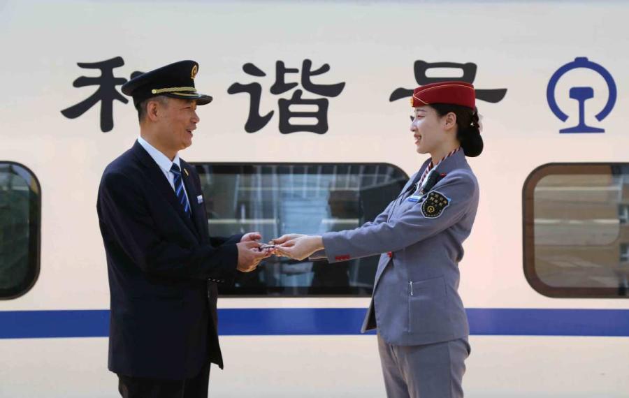 Sun Mingjin has applied for a high-speed train key, even though he didn\'t get a chance to work on these trains. (Photo by Qu Xiaoxi for chinadaily.com.cn)