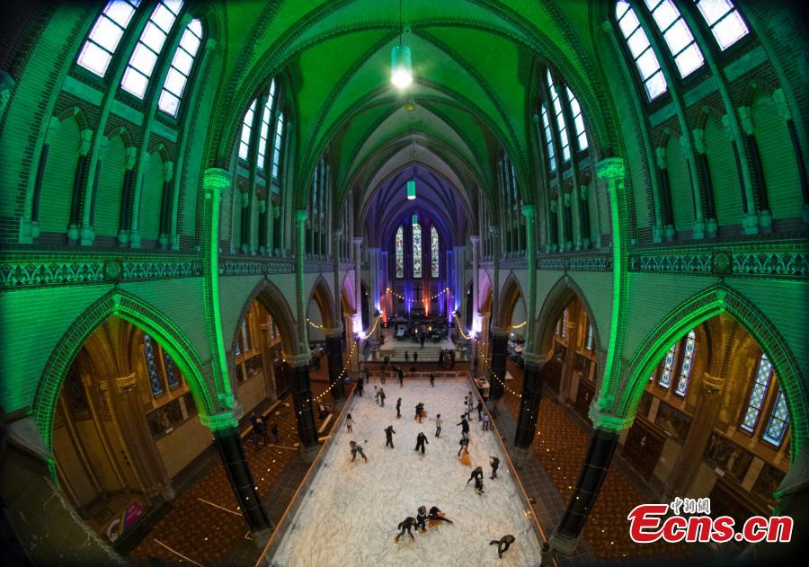 People skate on a temporary ice rink in the Gouwe Kerk church, a Gothic Revival church built between 1902 and 1904, in the center of Gouda, central Netherlands, Wednesday, Dec. 5, 2018. The ice rink will remain in the church till Dec. 16, and from Dec. 19, people can enjoy skating on the rink in front of the historic town hall of Gouda. (Photo/Agencies)