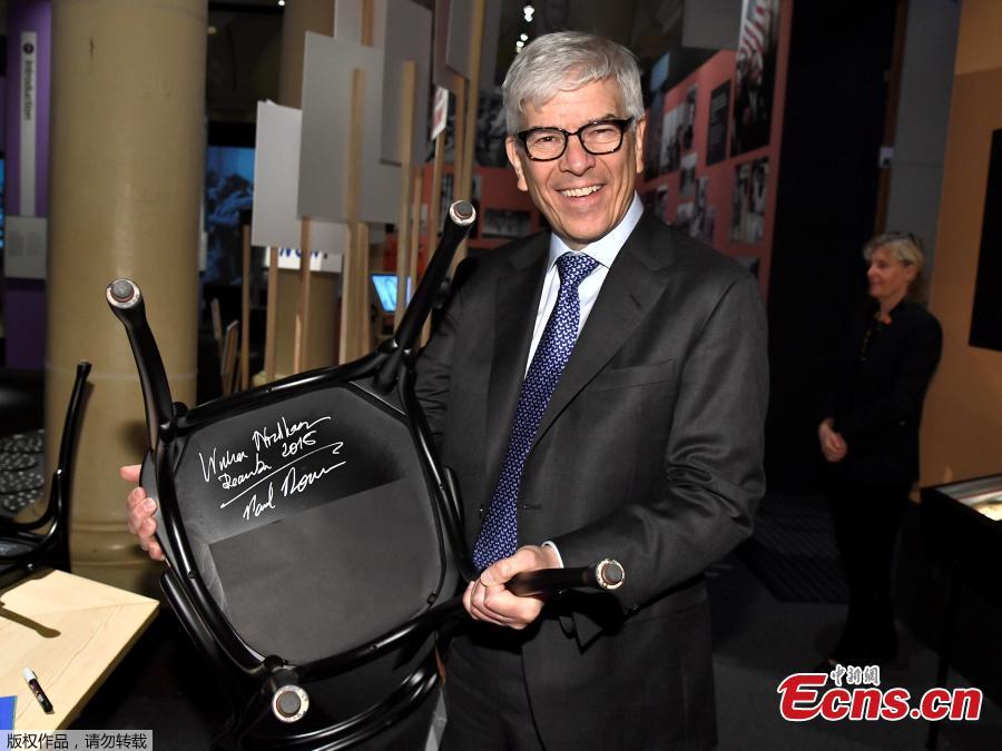 The Nobel Prize laureate in economics Professor Paul M. Romer holds a chair he has signed at the Nobel Museum in Stockholm, Sweden on December 6, 2018. (Photo/Agencies)