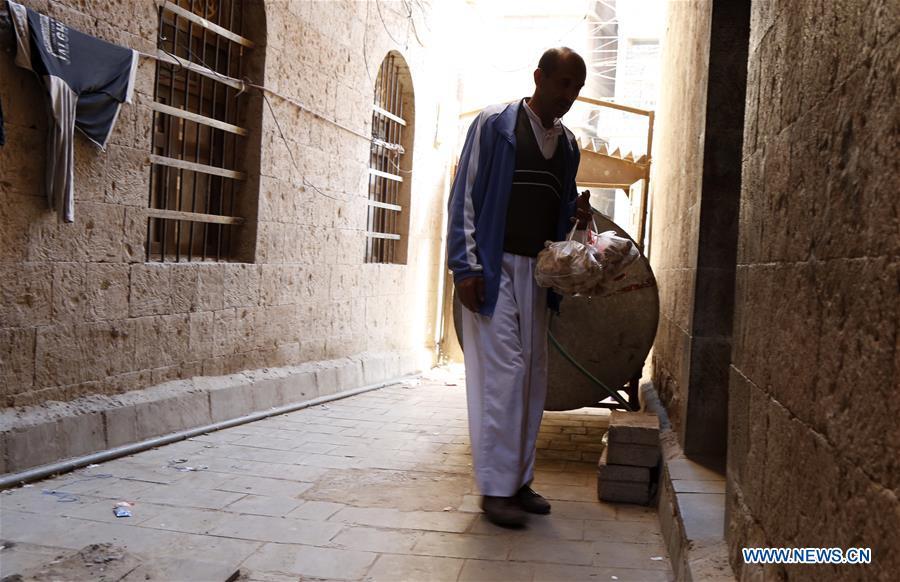 Ahmed al-Sharafi returns home after receiving food aid from a charity center in Sanaa, Yemen, on Dec. 9, 2018. An estimated 85,000 children under the age of five may have died from extreme hunger between April 2015 and October 2018, according to the latest data released by Save the Children, an international organization for children\'s rights. (Xinhua/Mohammed Mohammed)