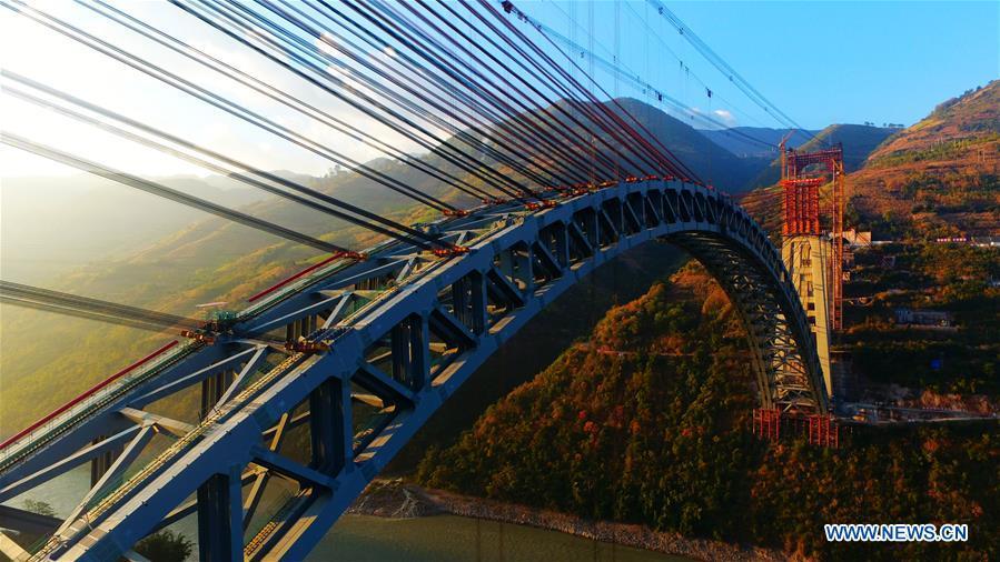 Photo taken on Dec. 10, 2018 shows the railway arch bridge across the Nujiang River in southwest China\'s Yunnan Province. With a grand arch bridge erected on Monday morning, Chinese constructors have built the longest-spanning railway arch bridge with a single span of 490 meters. The bridge is a key project of the 220-km-long Dali-Ruili railway which is a key section of the China-Myanmar international railway corridor linking Kunming, the provincial capital of Yunnan, with Yangon of Myanmar. (Xinhua)
