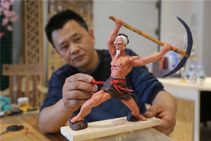 Gao Shan, 43, has been making dough figurines for more than 10 years in Jiyuan city, Central China\'s Henan province.  (Photo by Li Hao/for chinadaily.com.cn) 

Gao Shan, 43, has been making dough figurines for more than 10 years in Jiyuan city, Central China\'s Henan province.

The traditional craft dates back to the late Yuan Dynasty (1271-1368) and is listed as a provincial intangible cultural heritage. Folk artists make the figures by hand, using wheat flour and glutinous rice flour as raw materials.

Gao learned the traditional skill from his grandfather in childhood. He said \