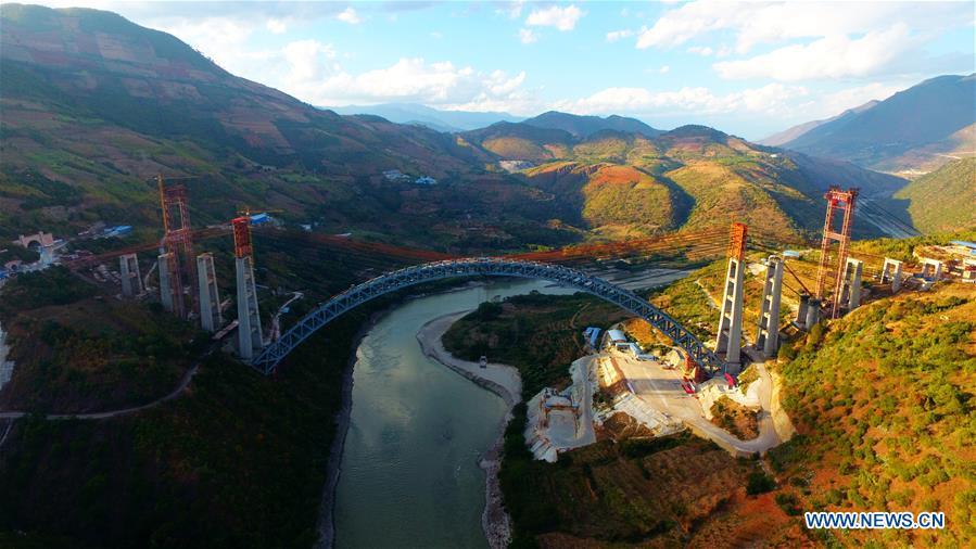 Aerial photo taken on Dec. 9, 2018 shows the railway arch bridge across the Nujiang River in southwest China\'s Yunnan Province. With a grand arch bridge erected on Monday morning, Chinese constructors have built the longest-spanning railway arch bridge with a single span of 490 meters. The bridge is a key project of the 220-km-long Dali-Ruili railway which is a key section of the China-Myanmar international railway corridor linking Kunming, the provincial capital of Yunnan, with Yangon of Myanmar. (Xinhua)