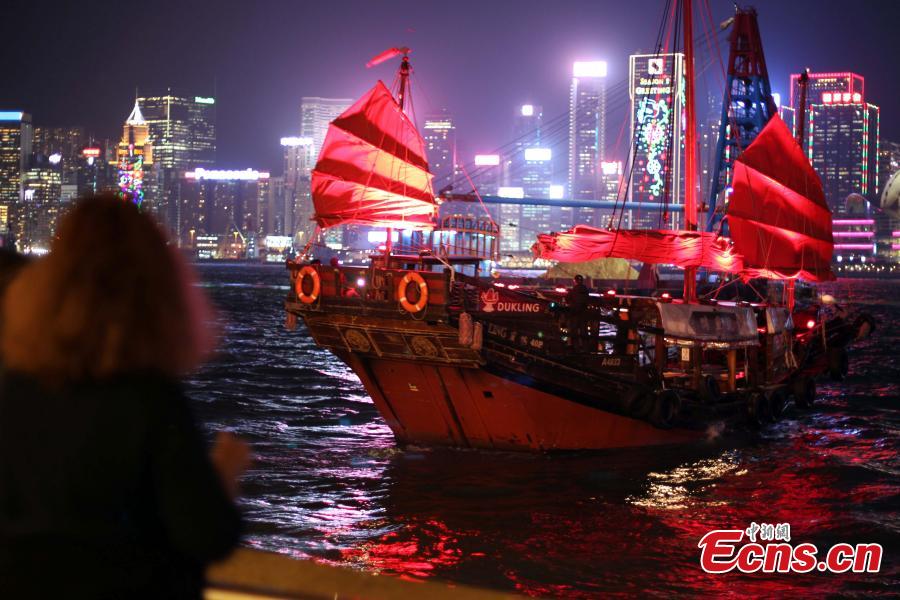 Photo taken on the evening of Dec. 11, 2018 shows shopping malls decorated with Christmas ornaments and lights at Tsim Sha Tsui in Kowloon, Hong Kong. The Hong Kong?Zhuhai?Macau Bridge and the Guangzhou?Shenzhen?Hong Kong Express Rail Link, which both went into service this year, are expected to boost sales during the festive season. (Photo: China News Service/Hong Shaokui)