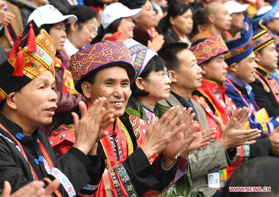 Spectators applause during a grand gathering held to celebrate the 60th anniversary of the founding of south China\'s Guangxi Zhuang Autonomous Region in Nanning, capital of Guangxi, Dec. 10, 2018. (Xinhua/Zhou Hua)