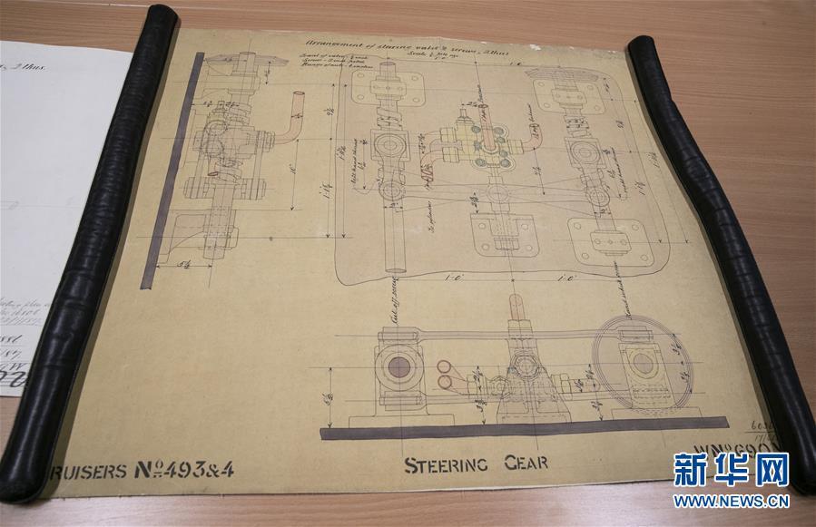 Archivist Rachel Gill shows the original designs for Chinese cruiser Zhiyuan at Tyne & Wear Archives in the city of Newcastle upon Tyne, England, Nov. 2, 2018. Zhiyuan, built and completed in England in 1887, was one of the most advanced warships in the Beiyang Fleet. It sank after the imperial Chinese navy was defeated in 1894 by the Japanese navy in the Battle of the Yellow Sea. The museum has a set of seven design drawings related to the Chinese cruiser. (Photo/Xinhua)