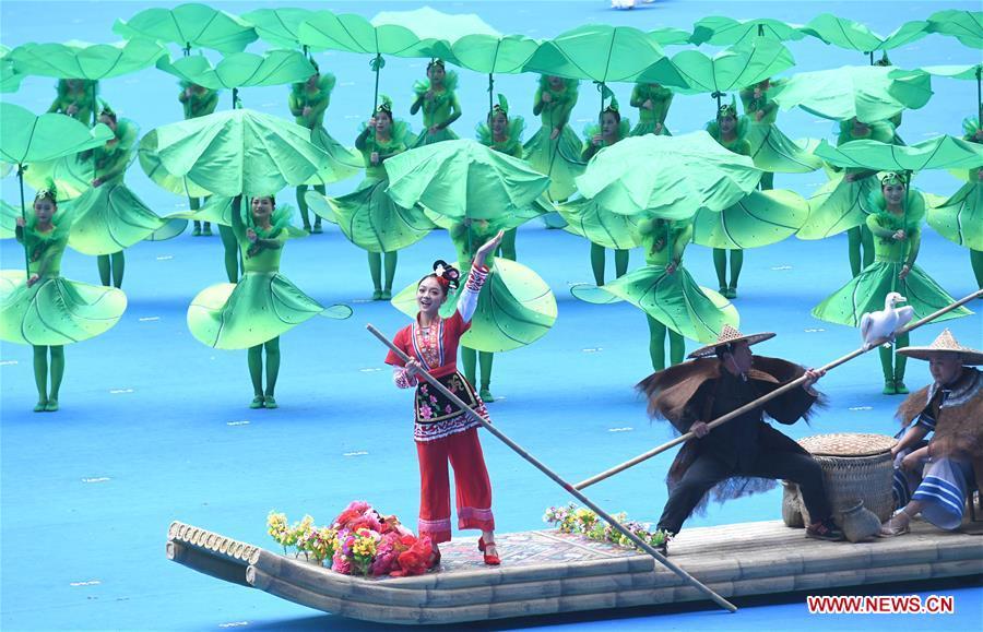 Dancers perform in a grand gathering held to celebrate the 60th anniversary of the founding of south China\'s Guangxi Zhuang Autonomous Region in Nanning, capital of Guangxi, Dec. 10, 2018. (Xinhua/Zhou Hua)