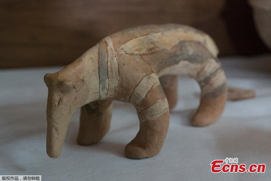 A Karaja culture ceramic depicting an armadillo rescued from the ashes of the fire that swept through Rio’s National Museum in September, is displayed during a media presentation, in Rio de Janeiro, Brazil, Dec. 10, 2018. The director of the National Museum and the German consul hosted the press conference to announce their partnership for the reconstruction of the museum. (Photo/Agencies)

Researchers from Brazil’s National Museum said Monday that they had recovered more than 1,500 pieces from the debris following a massive fire. The Sept. 2 blaze, which gutted one of the world’s oldest museums, destroyed much of the 20 million piece collection, and recovering objects from the ashes has been slow.