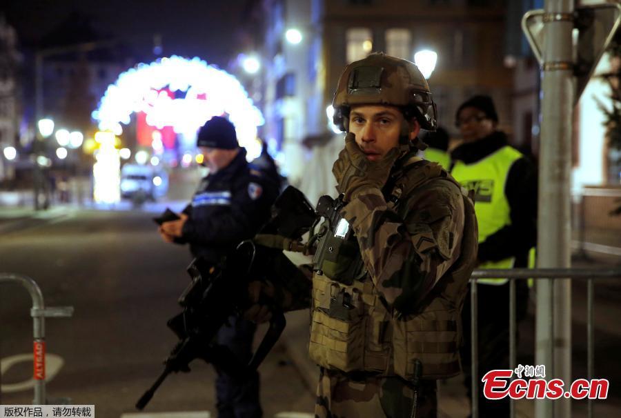 Police officers secure a street and the surrounding area after a shooting in Strasbourg, France, December 11, 2018. (Photo/Agencies)
The death toll of the shooting near a Christmas market in the French city of Strasbourg Tuesday evening has risen to four, several were wounded, local media reported. Security officers have cordoned off the area, while the injured were transported to a local hospital center. Interior Minister Christophe Castaner told reporters that several of the wounded were in critical condition and that he was heading to Strasbourg. According to sources from local authorities, the suspected gunman identified as 29-year-old and known to police for criminal activity, has been cornered. Police had reportedly exchanged gunfire with the suspect during the chase.