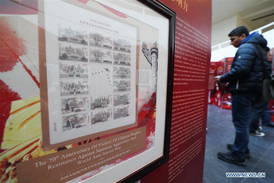Visitors watch the stamps showing China\'s global influence during the \