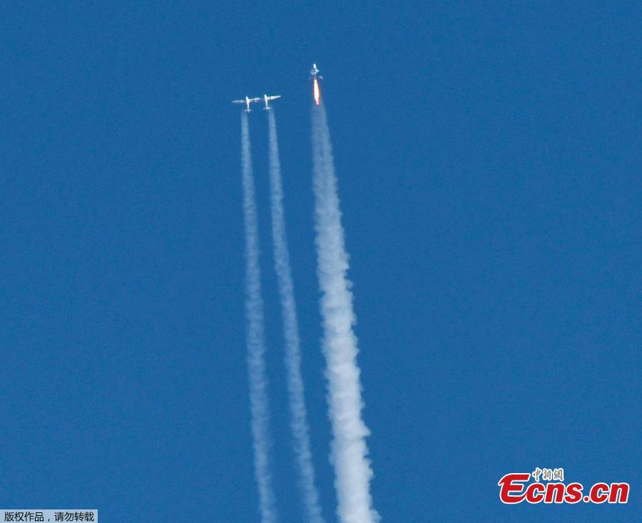 Virgin Galactic\'s VSS Unity launches for a suborbital test flight on December 13, 2018, in Mojave, California. Virgin Galactic marked a major milestone on Thursday as its spaceship made it to a peak height, or apogee, of 51.4 miles (82.7 kilometers), after taking off attached to an airplane from Mojave, California, then firing its rocket motors to reach new heights.(Photo/Agencies)
