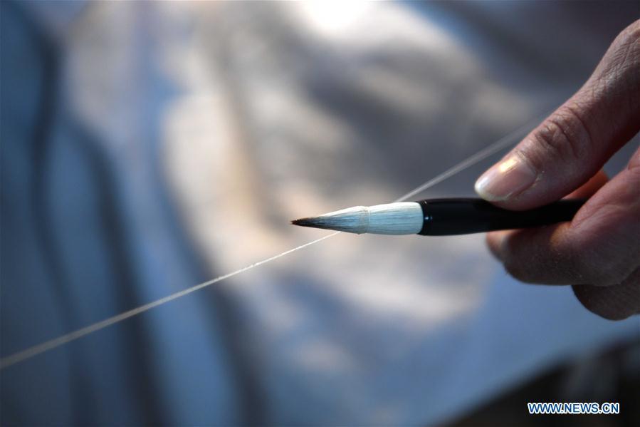 A worker makes the Xuan ink brush at a workshop in Huangcun Town of Jingxian County, east China\'s Anhui Province, Dec. 14, 2018. Huangcun Town has a long history of the Xuan ink brush making. The ink brush, ink, Chinese Xuan paper and ink slabs are four traditional writing materials of Chinese stationery. (Xinhua/Liu Junxi)