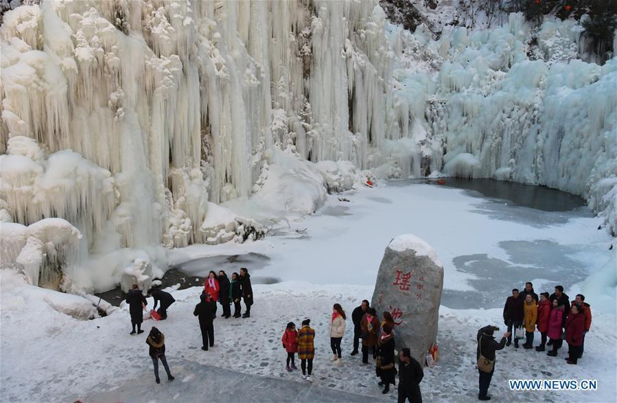 Tourists admire icicles at Dadunxia scenic spot in Linxia Hui Autonomous Prefecture, northwest China\'s Gansu Province, Dec. 16, 2018. (Xinhua/Shi Youdong)