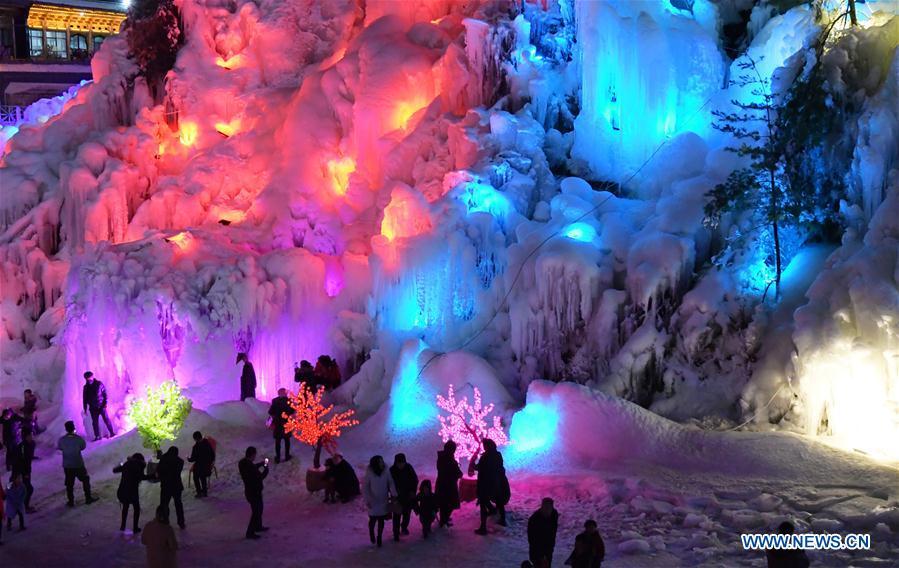 Tourists admire icicles at Dadunxia scenic spot in Linxia Hui Autonomous Prefecture, northwest China\'s Gansu Province, Dec. 16, 2018. (Xinhua/Shi Youdong)