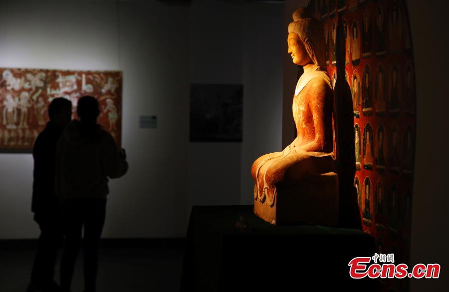 An exhibition of Dunhuang art masterpieces in Shanghai, Dec. 20, 2018. The non-profit exhibition tour at universities brought 66 large-size digital high-definition murals from the Mogao Caves. (Photo: China News Service/Tang Yanjun)