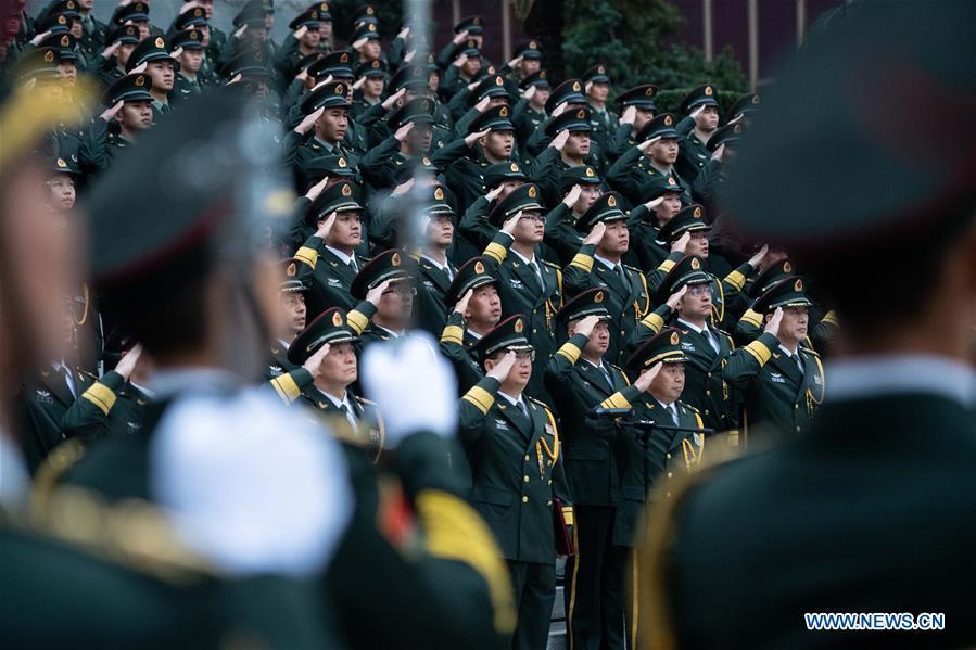 The Macao garrison of the Chinese People\'s Liberation Army (PLA) holds a flag-raising ceremony to celebrate the 19th anniversary of Macao\'s return to the motherland in Macao, south China, Dec. 20, 2018. (Xinhua/Cheong Kam Ka)