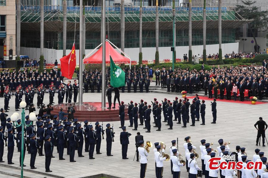 A flag-raising ceremony is held to celebrate the 19th anniversary of Macao\'s return to the motherland in Macao, south China, Dec. 20, 2018.