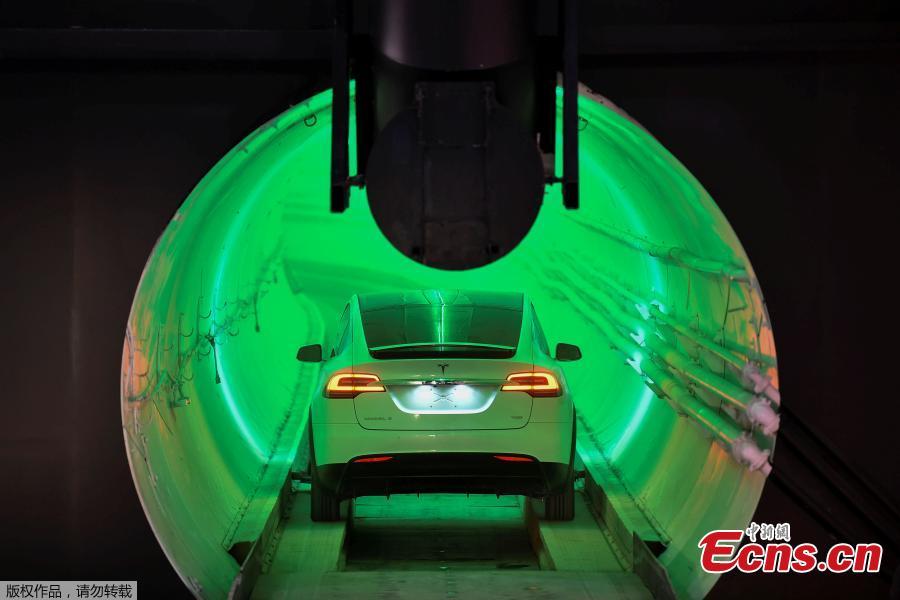 Elon Musk, co-founder and chief executive officer of Tesla Inc., arrives in a modified Tesla Model X electric vehicle during an unveiling event for the Boring Company Hawthorne test tunnel in Hawthorne, California, U.S., Dec. 18, 2018. Musk unveiled his underground transportation tunnel on Tuesday, allowing reporters and invited guests to take some of the first rides in the revolutionary albeit bumpy subterranean tube — the tech entrepreneur\'s answer to what he calls \