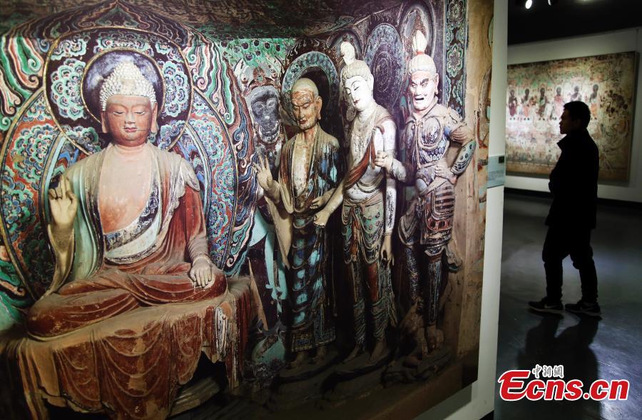 An exhibition of Dunhuang art masterpieces in Shanghai, Dec. 20, 2018. The non-profit exhibition tour at universities brought 66 large-size digital high-definition murals from the Mogao Caves. (Photo: China News Service/Tang Yanjun)