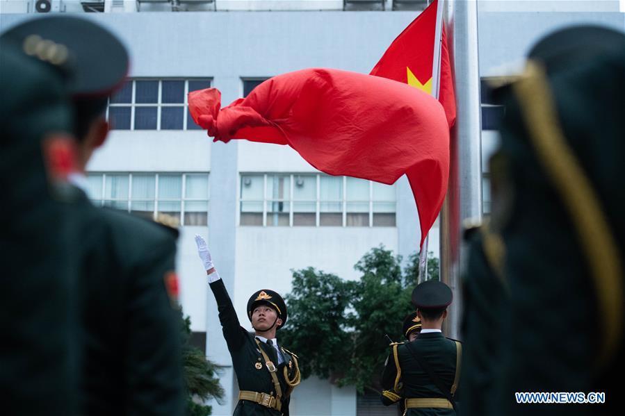The Macao garrison of the Chinese People\'s Liberation Army (PLA) holds a flag-raising ceremony to celebrate the 19th anniversary of Macao\'s return to the motherland in Macao, south China, Dec. 20, 2018. (Xinhua/Cheong Kam Ka)