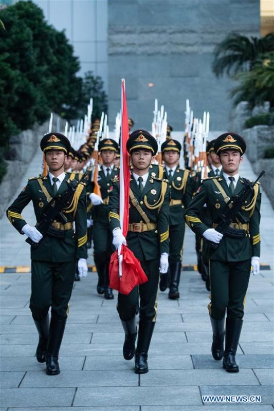 The Macao garrison of the Chinese People\'s Liberation Army (PLA) holds a flag-raising ceremony to celebrate the 19th anniversary of Macao\'s return to the motherland in Macao, south China, Dec. 20, 2018. (Xinhua/Cheong Kam Ka)
