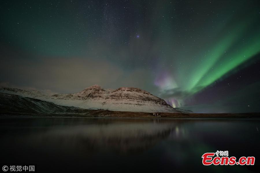 Aurora Borealis, the Northern Lights, over Kirkjufell, a 463 meter mountain on the west coast of Iceland. (Photo by Owen Humphreys/PA Images via Getty Images)