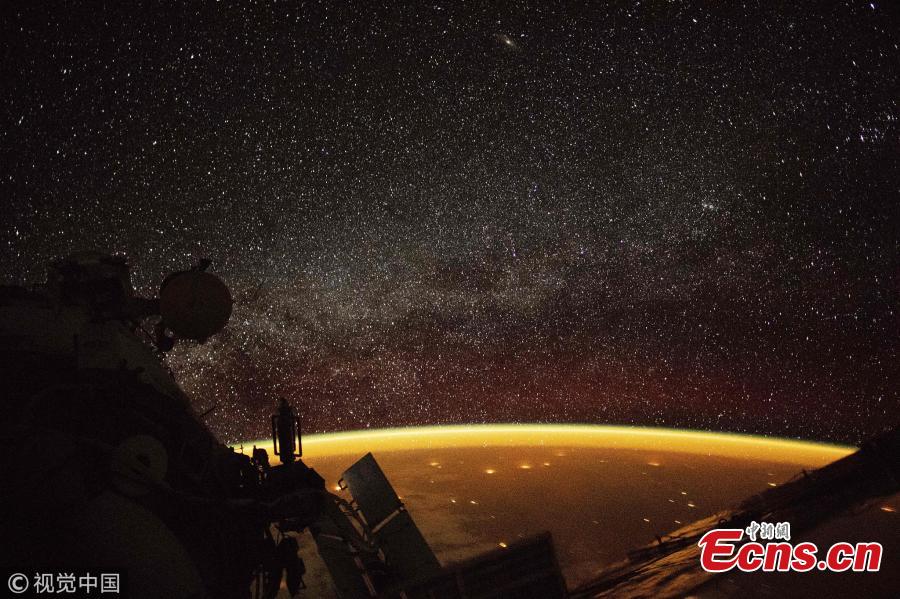 An orange hue envelops the Earth, known as \