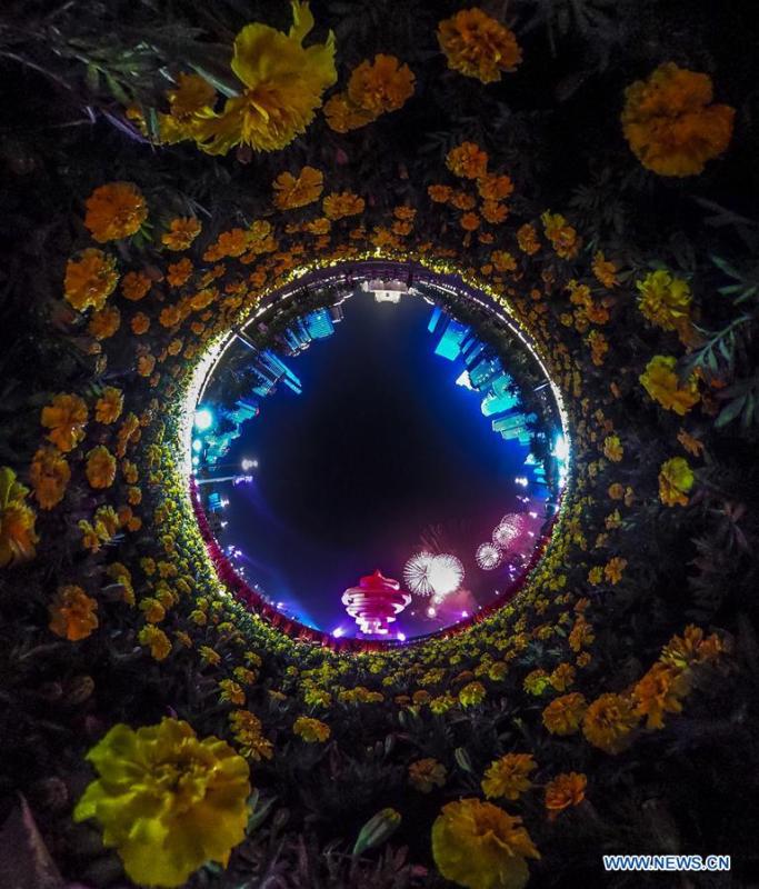 This photo taken on June 9, 2018 by a panorama camera shows a lights and fireworks show in Qingdao, the host city of the 18th Shanghai Cooperation Organization (SCO) summit, in east China\'s Shandong Province. The living and working scenes of Chinese people in the past year have created a series of amazing views, some of which formed geometric figures. Those photos tell the development and progress of the country in 2018. (Xinhua/Yin Gang)