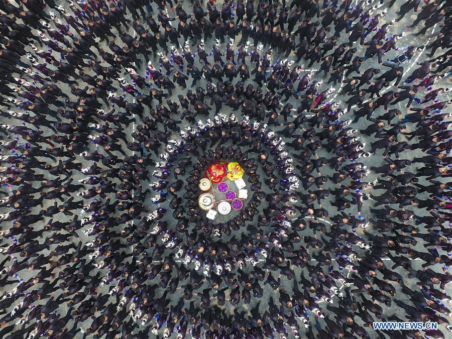 People of Dong ethnic group attend Duoye, a traditional celebrating activity, in Congjiang County, southwest China\'s Guizhou Province, Feb. 19, 2018. The living and working scenes of Chinese people in the past year have created a series of amazing views, some of which formed geometric figures. Those photos tell the development and progress of the country in 2018. (Xinhua/Zhang Qi)