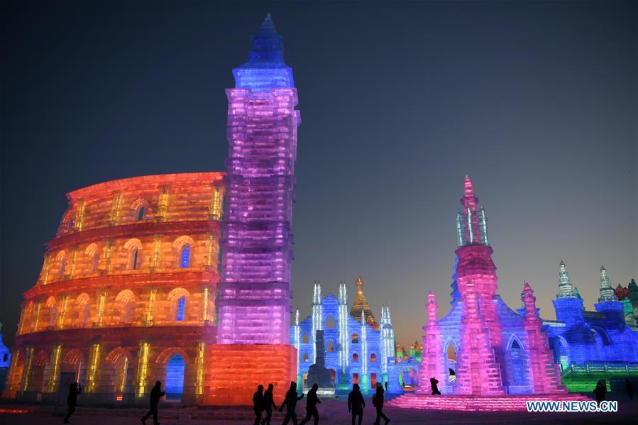 Tourists visit the Ice-Snow World in Harbin, capital of northeast China\'s Heilongjiang Province, Dec. 23, 2018. The Ice-Snow World opened on Sunday in Harbin. Covering an area of 600,000 square meters, the park used 110,000 cubic meters of ice and 120,000 cubic meters of snow this year. (Xinhua/Wang Jianwei)
