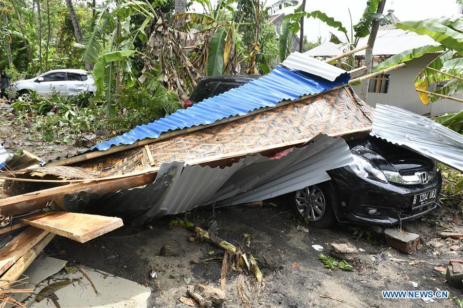 A car is buried in debris after a tsunami hit Sunda Strait in Pandeglang, Banten province, in Indonesia, Dec. 23, 2018. The total casualty of a tsunami triggered by the eruption of Krakatau Child volcano has increased to 168 people in coastal areas of Sunda Strait of western Indonesia, disaster agency official said here on Sunday. The catastrophe killed at least 168 people, wounded at least 745 ones and collapsed a total of 430 houses and nine hotels, and caused damages to scores of ships. (Xinhua/Wahyu Wening)