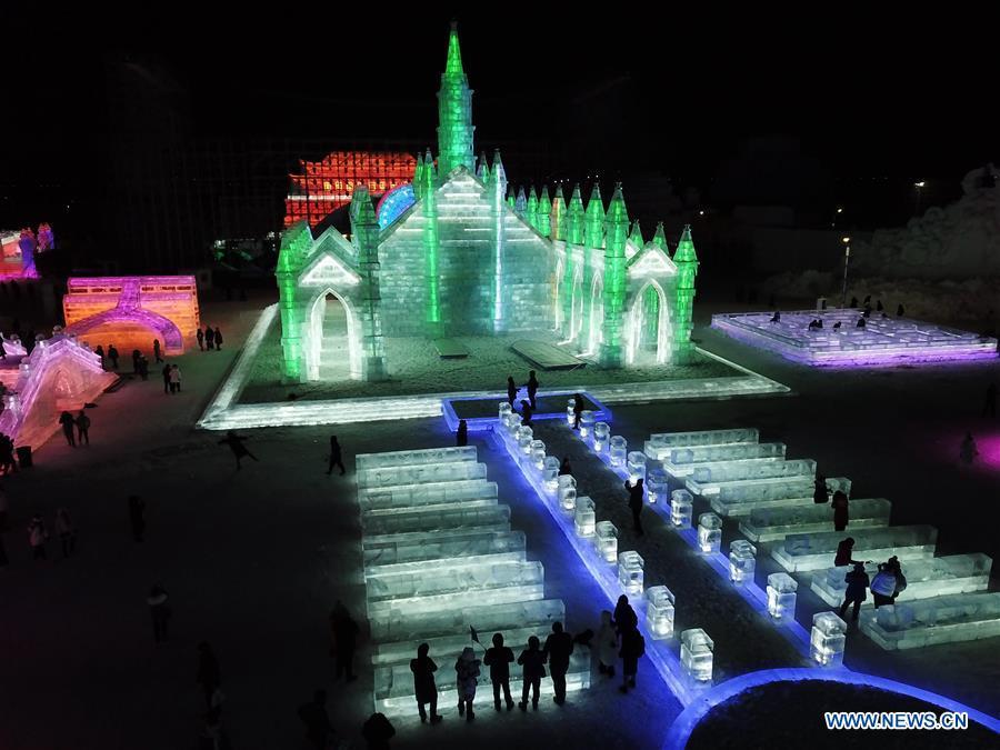 Aerial photo shows tourists visiting the Ice-Snow World in Harbin, capital of northeast China\'s Heilongjiang Province, Dec. 23, 2018. The Ice-Snow World opened on Sunday in Harbin. Covering an area of 600,000 square meters, the park used 110,000 cubic meters of ice and 120,000 cubic meters of snow this year. (Xinhua/Wang Song)