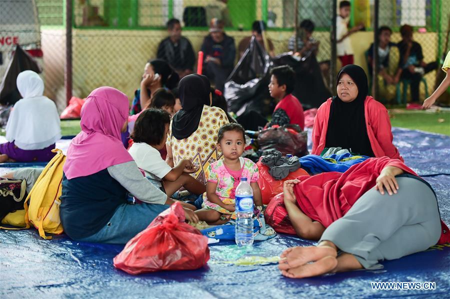 Tsunami survivors rest at a temporary shelter in Labuan of Pandeglang in Banten Province, Indonesia, Dec. 25, 2018. Casualty from the tsunami triggered by a volcanic eruption in Sunda Strait in Indonesia climbed to 429 people, and 16,802 others were displaced. (Xinhua/Du Yu)