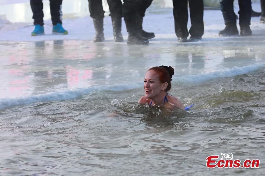 An international winter swimming invitational competition held in Hailar District, Hulunbuir City, North China’s Inner Mongolia Autonomous Region, Dec. 25, 2018. Hailar has hosted the event, China’s northernmost and lowest-temperature swimming competition, for five times, attracting over 100 participants from China and Russia this year. (Photo: China News Service/Li Rui)