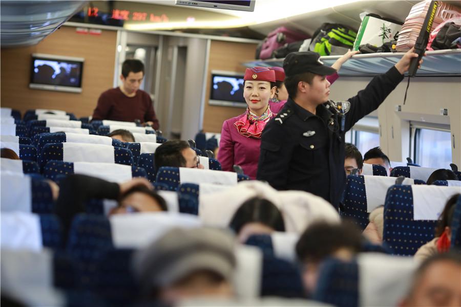 Liu and her colleagues check the luggage of passengers and inspect the carriage. (Photo provided to chinadaily.com.cn)