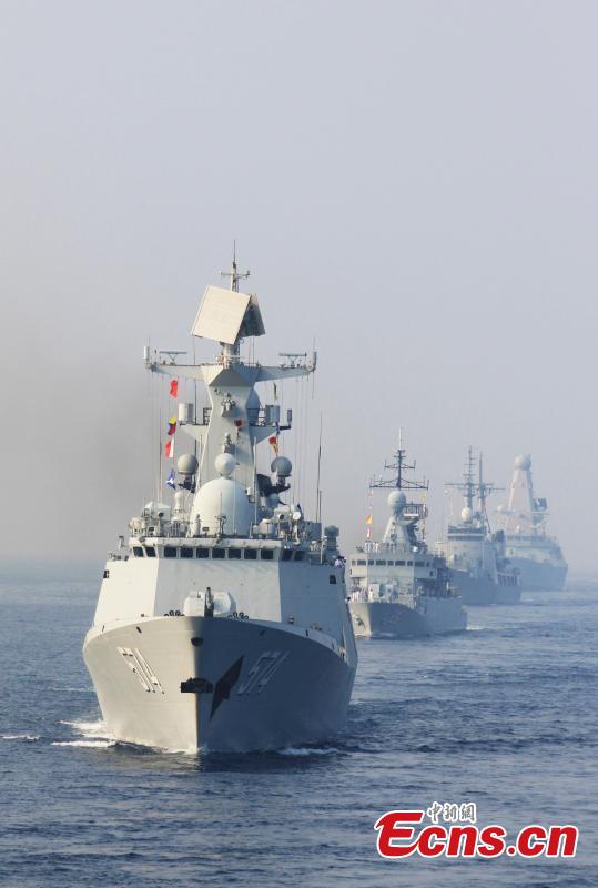 Warships from various countries sail in formation during a multinational joint navigation drill in India, Feb. 9, 2016. The guided-missile frigates Liuzhou and Sanya with the 21st Chinese naval escort taskforce conducted multinational joint navigation drill with warships from a few countries. (Photo: China News Service/ Zeng Xingjian)