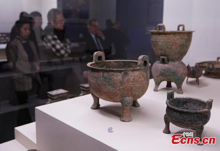 Cultural relics, including bronze wares and silver ingots, retrieved by police are on display at an exhibition at the National Museum of China in Beijing, Dec. 26, 2018. The exhibition displays 750 precious artifacts retrieved during police efforts in recent years fighting crime involving stolen cultural treasures, which hail from Neolithic times through to the Qing Dynasty. (Photo: China News Service/Du Yang)