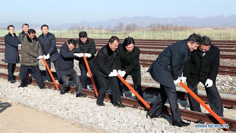 Guests take part in the groundbreaking ceremony for rail and road connection across border between South Korea and the Democratic People\'s Republic of Korea (DPRK) at Panmun Station in the DPRK\'s border town of Kaesong on Dec. 26, 2018. South Korea and DPRK on Wednesday held a groundbreaking ceremony to modernize and eventually connect railways and roads across the inter-Korean border. (Xinhua)