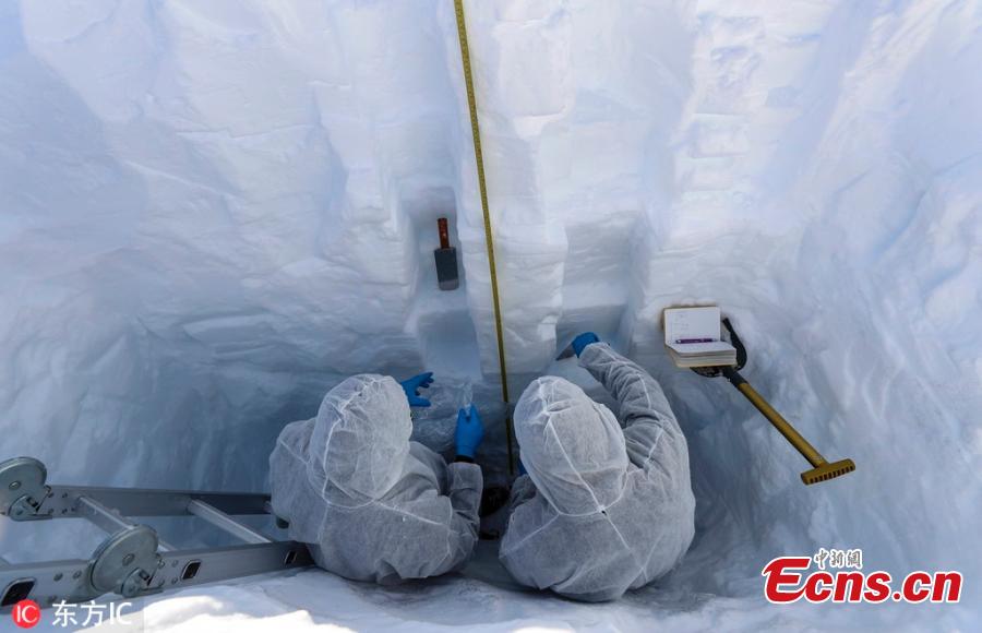 Scientists Juan Manuel Carrera (R) from Venezuela and Jose Jorquera (L) from Chile work inside a snow trial pit on the Union Glacier in the Ellsworth Mountains, Antarctica, Dec. 5, 2018. A group of eight researchers take part in the first activity of the LV Scientific Antarctic Expedition organized by the Chilean Antarctic Institute (INACH). The Glacier Union camp is a Chilean polar station operated by the three groups of the Armed Forces of Chile and the INACH, and marks the beginning of all scientific activities planned in the Antarctic territory for the summer season. Glacier Union is the third most southern camp of the continent and it is only open for a month. (Photo/Agencies)