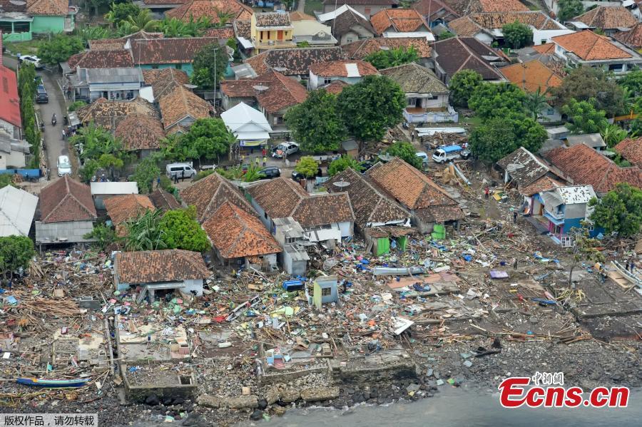 Damaged buildings are seen along a beach after a tsunami in Banten province, Indonesia, Dec. 26, 2018. Indonesia on Thursday raised the alert level for the erupting Anak Krakatau volcano to the second-highest, and ordered all flights to steer clear, days after it triggered a tsunami that killed at least 430 people. (Photo/Agencies)
