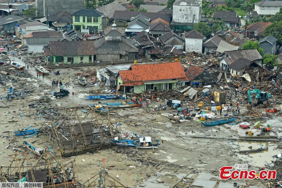 Damaged buildings are seen along a beach after a tsunami in Banten province, Indonesia, Dec. 26, 2018. Indonesia on Thursday raised the alert level for the erupting Anak Krakatau volcano to the second-highest, and ordered all flights to steer clear, days after it triggered a tsunami that killed at least 430 people. (Photo/Agencies)