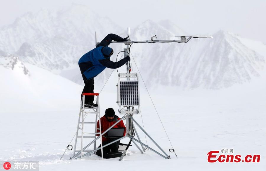 Chilean scientists Ricardo Jana (L) and Francisco Aguirre (R) work on an automatic weather station on the Union Glacier in the Ellsworth Mountains, Antarctica, Nov. 24, 2018. A group of eight researchers take part in the first activity of the LV Scientific Antarctic Expedition organized by the Chilean Antarctic Institute (INACH). The Glacier Union camp is a Chilean polar station operated by the three groups of the Armed Forces of Chile and the INACH, and marks the beginning of all scientific activities planned in the Antarctic territory for the summer season. Glacier Union is the third most southern camp of the continent and it is only open for a month. (Photo/Agencies)