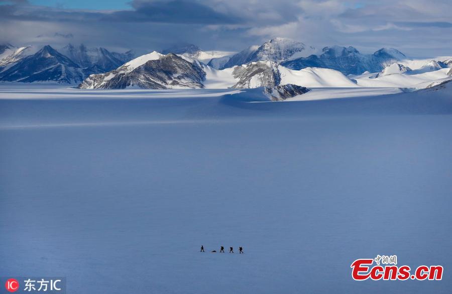 Chilean scientist Ricardo Jana (L) and a group of military explorers track an area with GPS near the Higgins Nunatak, on the Union Glacier in the Ellsworth Mountains, Antarctica, Nov. 29, 2018. A group of eight researchers is taking part in the first activity of the LV Scientific Antarctic Expedition organized by the Chilean Antarctic Institute (INACH). The Glacier Union camp is a Chilean polar station operated by the three groups of the Armed Forces of Chile and the INACH, and marks the beginning of all scientific activities planned in the Antarctic territory for the summer season. Glacier Union is the third most southern camp of the continent and it is only open for a month. (Photo/Agencies)