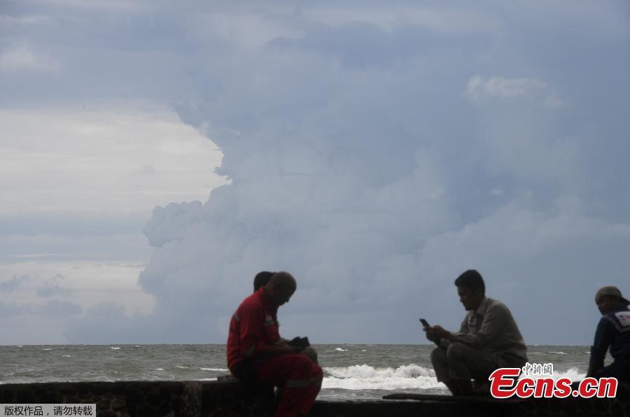Mount Anak Krakatau volcano spews hot ash as seen from Sunda Strait, Lampung Province, Indonesia, Dec. 28, 2018. Indonesia on Thursday raised the alert level for the erupting Anak Krakatau volcano to the second-highest, and ordered all flights to steer clear, days after it triggered a tsunami that killed at least 430 people. (Photo/Agencies)