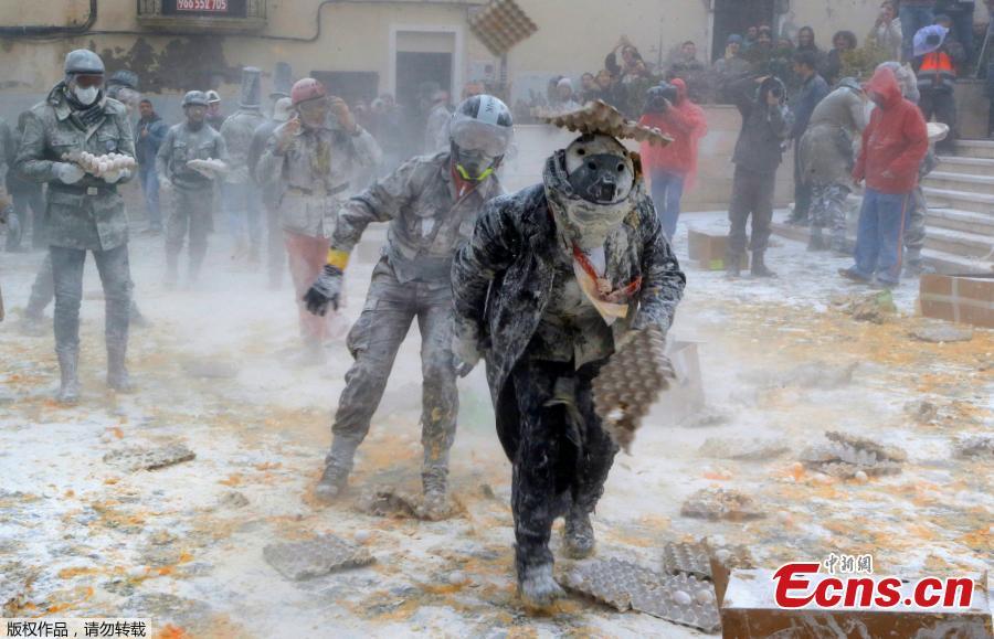 Revelers battle with flour and eggs during the traditional \